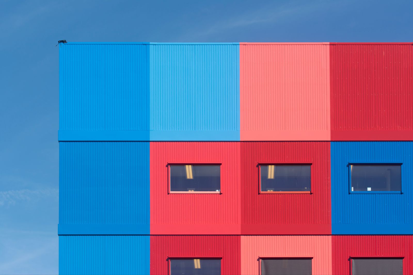 Blue and red architectural facade with a bold color finish